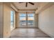 Bedroom with hardwood floors and large windows offering city views at 9101 Alta Dr # 1406, Las Vegas, NV 89145