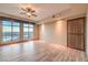 Spacious bedroom with hardwood floors, large windows, and city views at 9101 Alta Dr # 1406, Las Vegas, NV 89145