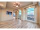 Bedroom with hardwood floors, city views and ceiling fan at 9101 Alta Dr # 1406, Las Vegas, NV 89145