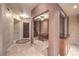 Elegant entryway with decorative flooring and built-ins at 9101 Alta Dr # 1406, Las Vegas, NV 89145