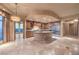 Open concept kitchen with granite island, stainless steel appliances, and custom cabinetry at 9101 Alta Dr # 1406, Las Vegas, NV 89145
