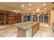 Open concept kitchen with large island, custom cabinetry, and city views at 9101 Alta Dr # 1406, Las Vegas, NV 89145