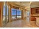 Gourmet kitchen boasts granite countertops, custom cabinetry, and expansive windows with city views at 9101 Alta Dr # 1406, Las Vegas, NV 89145