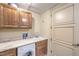 Bright laundry room with utility sink and cabinets at 9101 Alta Dr # 1406, Las Vegas, NV 89145