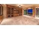 Spacious living room with built-in shelving and city views at 9101 Alta Dr # 1406, Las Vegas, NV 89145