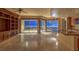Spacious living room with city views and built-in shelving at 9101 Alta Dr # 1406, Las Vegas, NV 89145