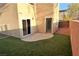 Small backyard with artificial turf and patio at 9869 Juno Hills St, Las Vegas, NV 89178