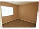 Simple bedroom with carpeted floors and window at 9869 Juno Hills St, Las Vegas, NV 89178