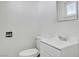 Clean bathroom with white vanity and toilet at 120 Maple St, Henderson, NV 89015