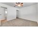 Bright bedroom with ceiling fan, closet, and access to another room at 120 Maple St, Henderson, NV 89015