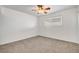 Spacious bedroom with ceiling fan and neutral carpeting at 120 Maple St, Henderson, NV 89015