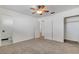 Bedroom with ceiling fan, closet and adjacent bathroom at 120 Maple St, Henderson, NV 89015