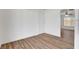 Dining area with wood-look floors and access to kitchen at 120 Maple St, Henderson, NV 89015