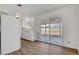 Kitchen with white cabinets, sliding door to patio and LVP flooring at 120 Maple St, Henderson, NV 89015