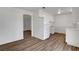 Kitchen with white cabinets and wood-look vinyl flooring at 120 Maple St, Henderson, NV 89015