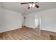 Bright living room with wood-look floors and ceiling fan at 120 Maple St, Henderson, NV 89015