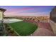 Landscaped backyard with pool and artificial turf at 1928 Oliver Springs St, Henderson, NV 89052