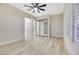 Well-lit bedroom with mirrored closet doors and wood-look floors at 1928 Oliver Springs St, Henderson, NV 89052