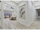 Modern hallway with geometric wall art and light wood floors at 1928 Oliver Springs St, Henderson, NV 89052