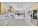 Open concept kitchen boasting a large island, stainless steel appliances, and white cabinetry at 1928 Oliver Springs St, Henderson, NV 89052