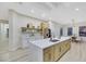 Modern kitchen with large island, stainless steel appliances, and white shaker cabinets at 1928 Oliver Springs St, Henderson, NV 89052