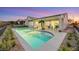 Stunning kidney-shaped pool with a large patio at 1928 Oliver Springs St, Henderson, NV 89052