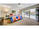 Bedroom with pool view, king bed and colorful bedding at 2240 Mohigan Way, Las Vegas, NV 89169