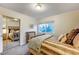 Bright bedroom with a comfortable bed, natural light from a window, and a mirrored closet at 2240 Mohigan Way, Las Vegas, NV 89169