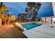 Relaxing pool area with fire pit and ample patio space at 2240 Mohigan Way, Las Vegas, NV 89169