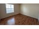 Bright bedroom with wood-look floors and large window at 2606 S Durango Dr # 172, Las Vegas, NV 89117