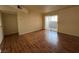 Living room with sliding doors to balcony and wood-look floors at 2606 S Durango Dr # 172, Las Vegas, NV 89117