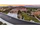 Luxury home nestled on a hillside with a stunning sunset view at 3 Palmbrook Ln, Henderson, NV 89052