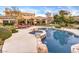 Resort-style backyard oasis featuring a sparkling pool and spa at 3 Palmbrook Ln, Henderson, NV 89052