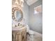 Elegant bathroom with a vanity, toilet, and decorative mirror at 3 Palmbrook Ln, Henderson, NV 89052