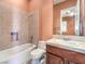 Clean bathroom with a shower/tub combo and wood vanity at 3 Palmbrook Ln, Henderson, NV 89052