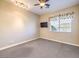 Spacious bedroom with ceiling fan, window, and neutral decor at 3 Palmbrook Ln, Henderson, NV 89052