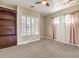 Spacious bedroom with ceiling fan, large window and access to bath and closet at 3 Palmbrook Ln, Henderson, NV 89052