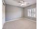 Neutral-toned bedroom with ceiling fan and large closet at 3 Palmbrook Ln, Henderson, NV 89052