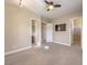 Bright bedroom with ceiling fan, window, and neutral decor at 3 Palmbrook Ln, Henderson, NV 89052