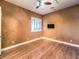 Spacious bedroom with hardwood floors and a ceiling fan at 3 Palmbrook Ln, Henderson, NV 89052