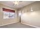 Spacious bedroom with ceiling fan, window, and neutral decor at 3 Palmbrook Ln, Henderson, NV 89052