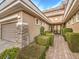 Elegant entryway with stone accents and meticulously landscaped grounds at 3 Palmbrook Ln, Henderson, NV 89052