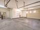 Large garage with ample storage and overhead racks at 3 Palmbrook Ln, Henderson, NV 89052