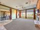 Living area features a fireplace, large windows, and patio access at 3 Palmbrook Ln, Henderson, NV 89052