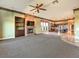 Open living space with a stone fireplace and kitchen views at 3 Palmbrook Ln, Henderson, NV 89052