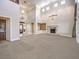 High-ceilinged living room with a fireplace and large windows at 3 Palmbrook Ln, Henderson, NV 89052