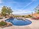 Inviting swimming pool with rock waterfall and spa at 3 Palmbrook Ln, Henderson, NV 89052