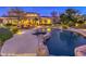 Backyard oasis with a large pool and spa, surrounded by landscaping at 3 Palmbrook Ln, Henderson, NV 89052