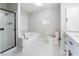 Renovated bathroom featuring a soaking tub and modern vanity at 3490 Allegheny Dr, Las Vegas, NV 89122