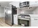 Stainless steel appliances and white cabinetry highlight this updated kitchen at 3490 Allegheny Dr, Las Vegas, NV 89122